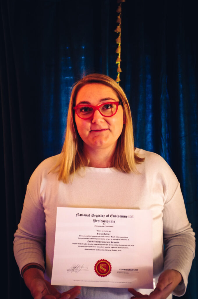 Sarah Doliber holding a certificate