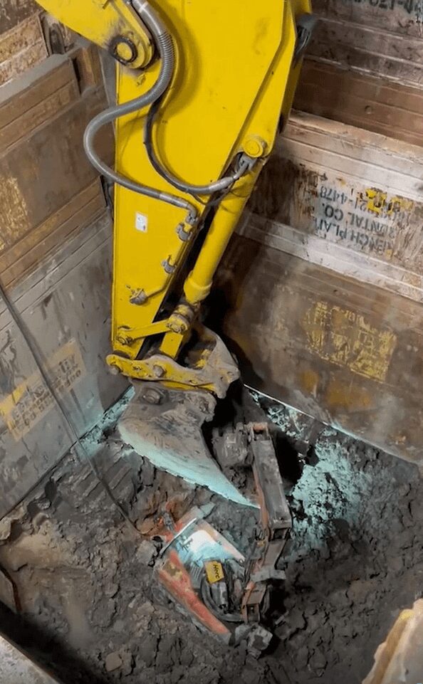 A bulldozer digging a hole in a building