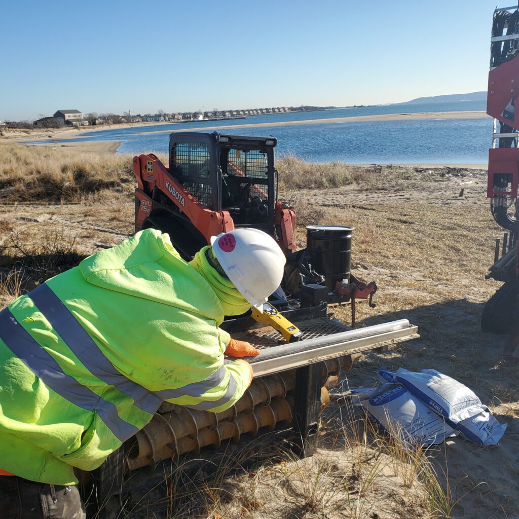 A person with an equipment at a site with water