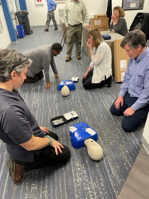 A group of people attending CPR training