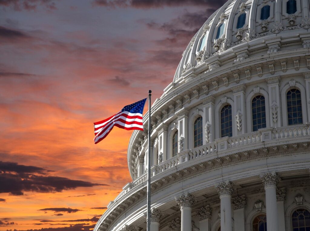 US Capitol building with American flag flying.